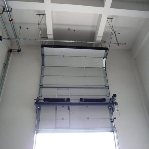 High speed rolling up overhead sectional door