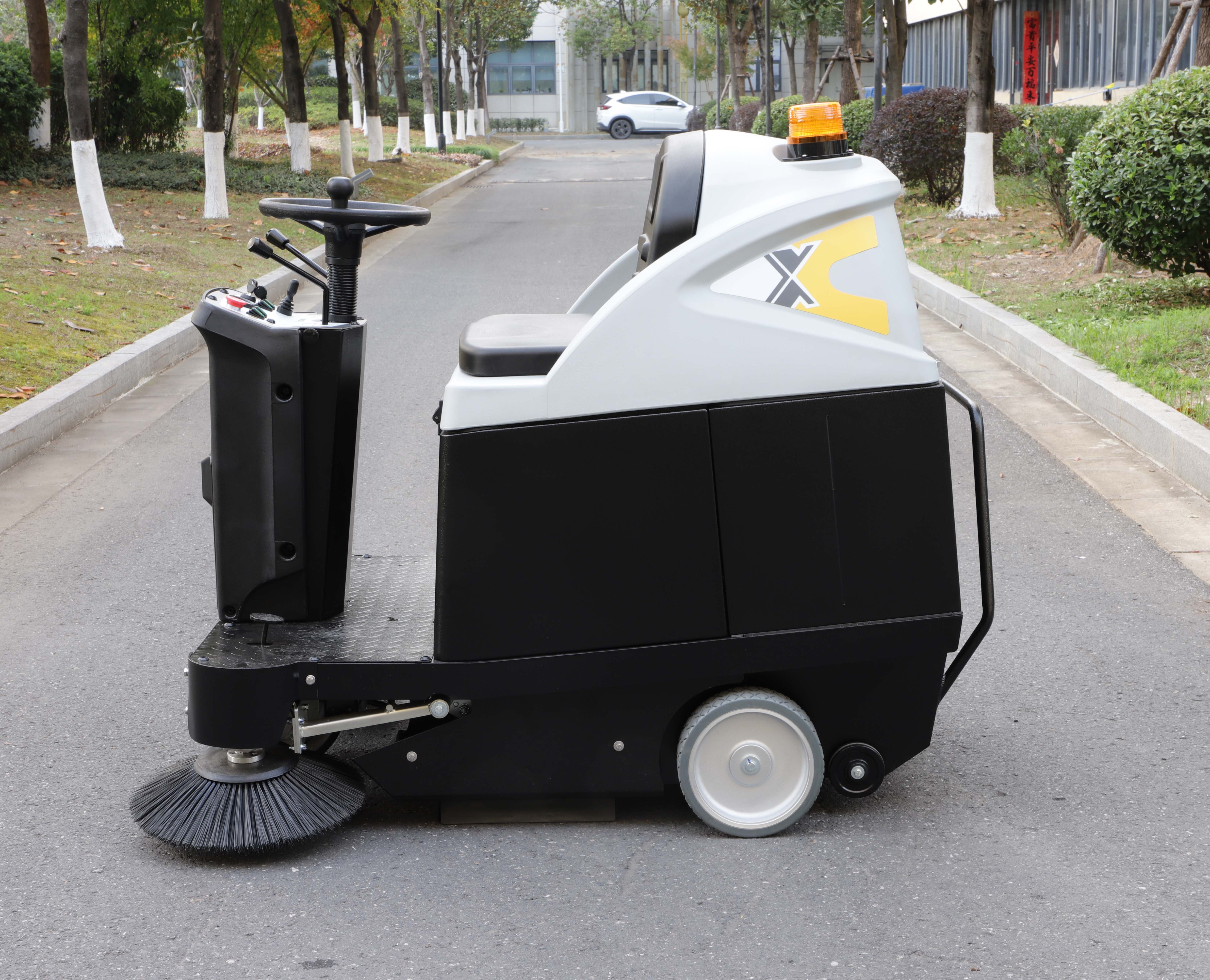 Ride-on floor sweeper