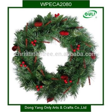 green artificial christmas wreaths with decoration