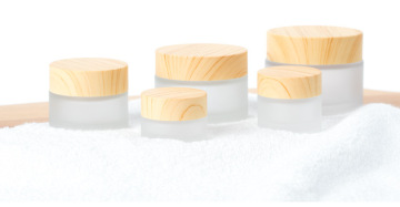 Wood grain glass frosted face cream bottled separately