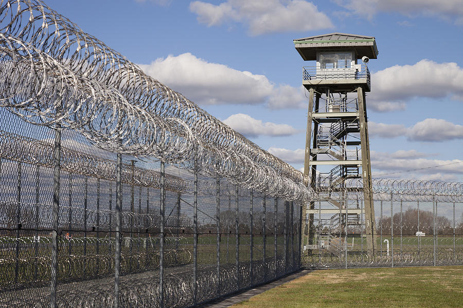 2-prison-fence-watch-tower-and-barbed-roberto-westbrook