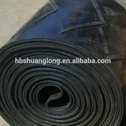 Rubber patterned chevron transmission belt