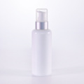 White glass lotion bottle with silver pump
