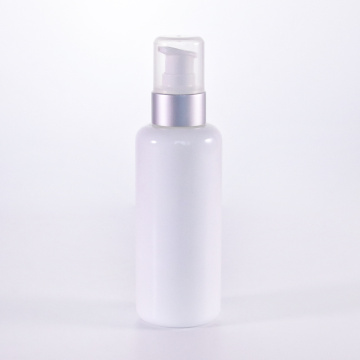 White glass lotion bottle with silver pump