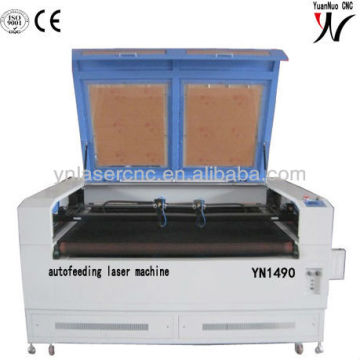 YN1490 autofeeding table laser dress cutting machine for wedding and baby cloth with high precision