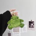 Plush little frog pendant in chubby sitting position