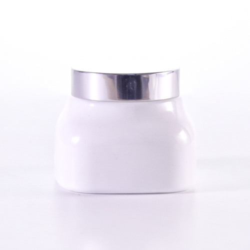 Square white glass cream jar with silver cap