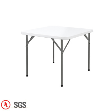 Klappbarer quadratischer Tisch aus weißem Kunststoff im Freien