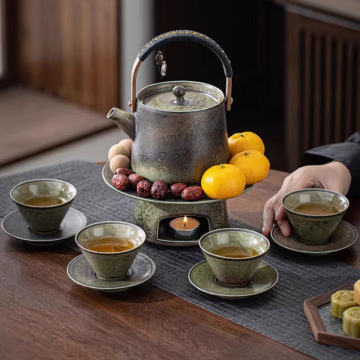 Set di tè di fascia alta vintage con abito di kung fu, caldaia d'acqua e tazza di caffè