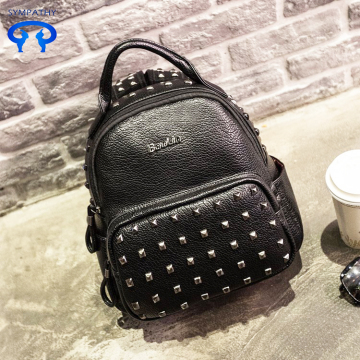 The rivet shoulder backpack style PU leather