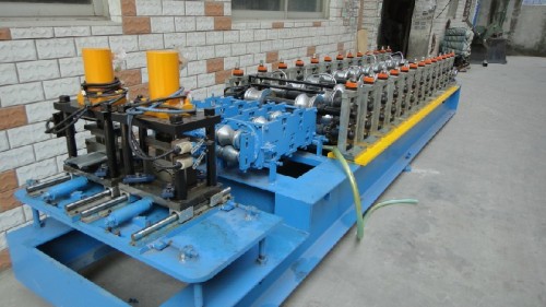 Steel shutter door roll forming machine