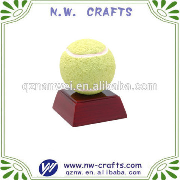 Resin tennis trophy on piano finish base