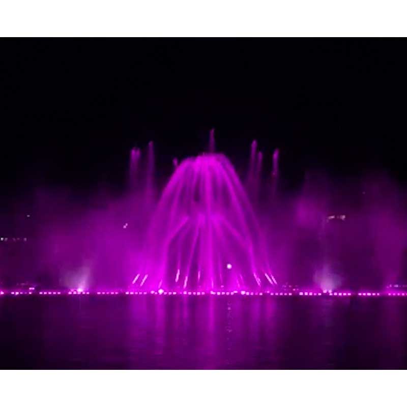 Fontana di musica a getto verticale multicolore con fumo di colore