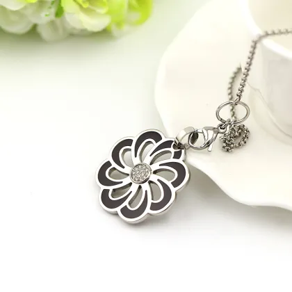 Flower pendant with black glue and crystal