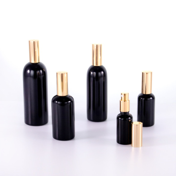 Black glass bottle with golden aluminium caps