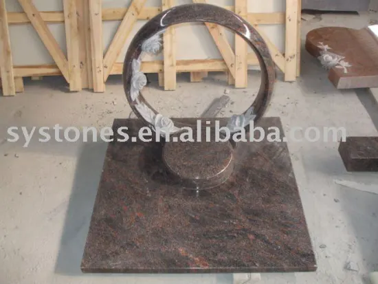 carved granite tombstone and headstone statue