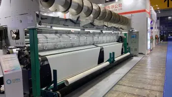 Tricot warp knitting machine