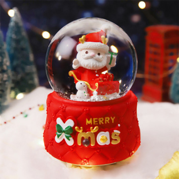 Resina personalizzabile Santa Snowball LED Music Box con sfera di cristallo natalizio rotante e effetto neve galleggiante