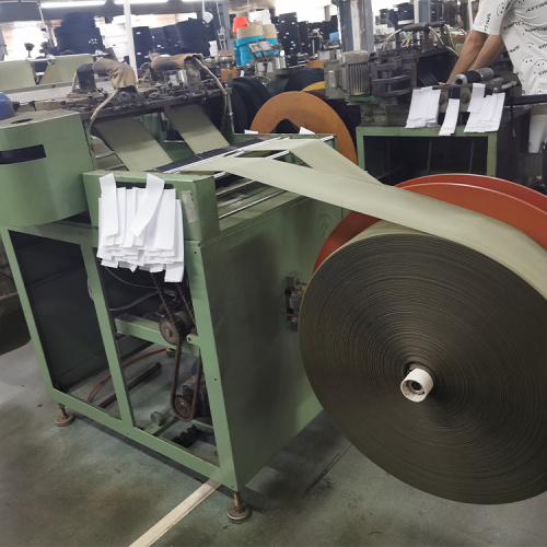 Hook and loop fastener hook tape cutting machine