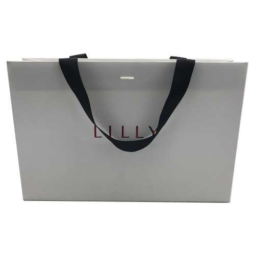 Corrugated paper gift containing shopping bag