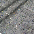 Tessuto per abiti con paillettes metalliche iridescenti olografiche