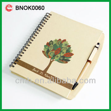 recycled paper notebook with pen
