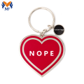 Keychain Croí Nope Miotail le Charm