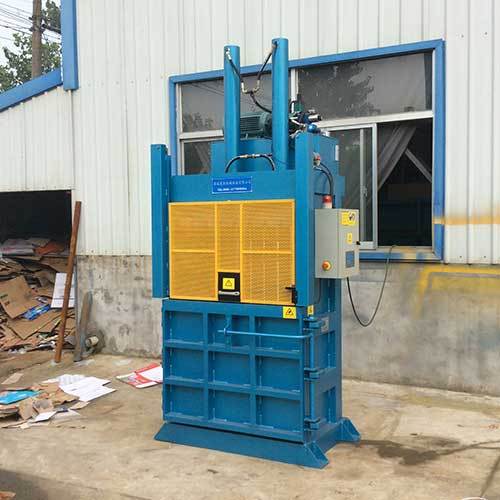 Baling Newspaper With A Vertical Baler