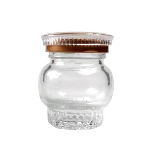 Botella de vidrio de mermelada de miel vacía para nido de pájaros