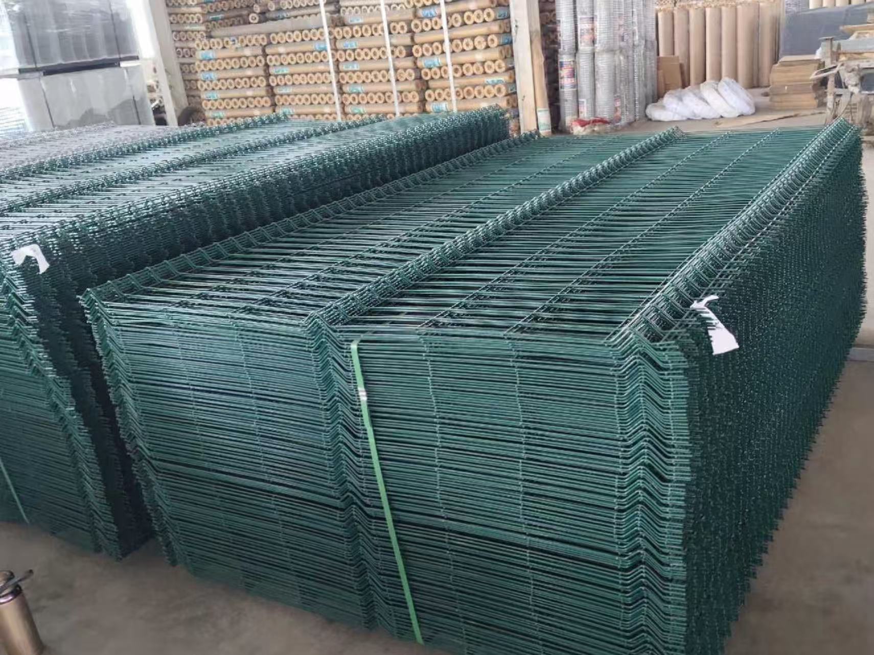 ANJIA Group – mass stock of green PVC coated 3D curved welded fence panels in warehouse