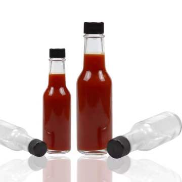 Bouteille en verre au piment à sauce piquante avec couvercle