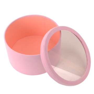 Scatola rotonda in pelle scamosciata rosa con coperchio della finestra in plastica