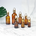 Botella de gotero de vidrio marrón ámbar para aceite esencial