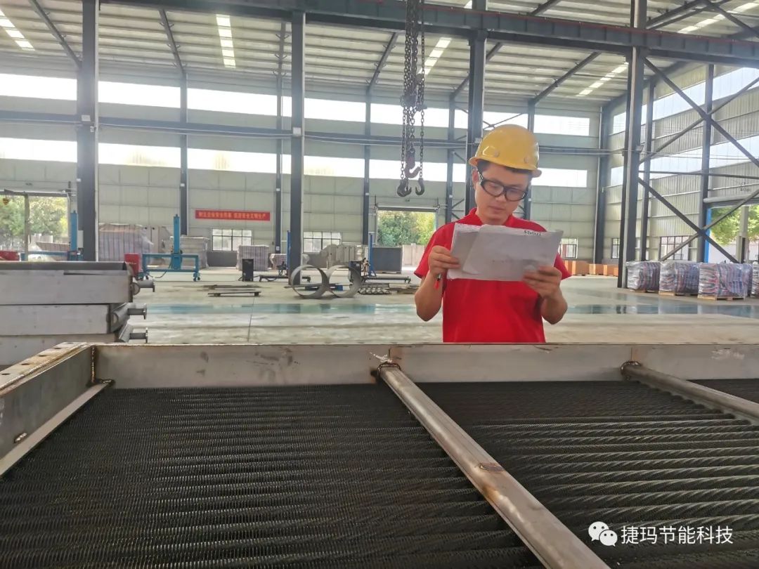 Haowen is checking the drawing for Air Exchanger Unit