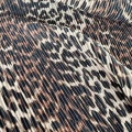 Tessuto pieghettato con stampa leopardata
