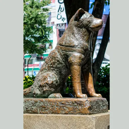 Antique cast bronze metal copper akita dog statue sculpture