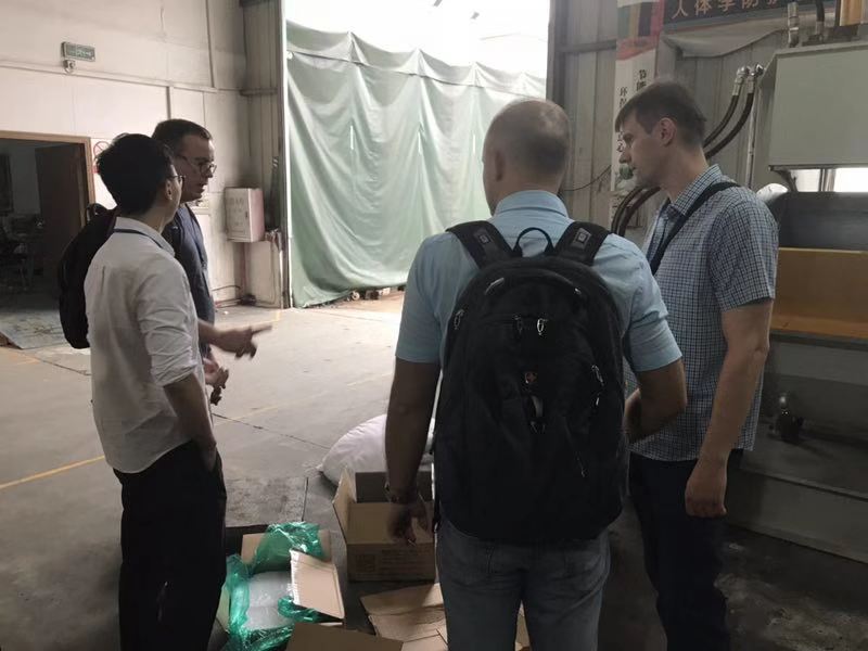 Russian engineers inspecting silicone rubber kneader