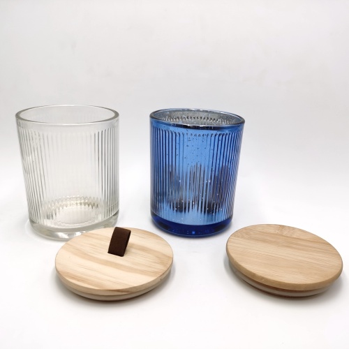 Mercury color inside ribbed glass candle jar with wood lid