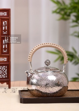 Luxury Hammered Silver Teapot with Artisanal Handle Detail