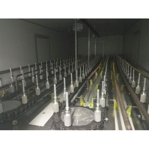 Industrial spray machine with UV curing dryer