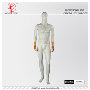 Old-fashioned effect male mannequin with wooden hands
