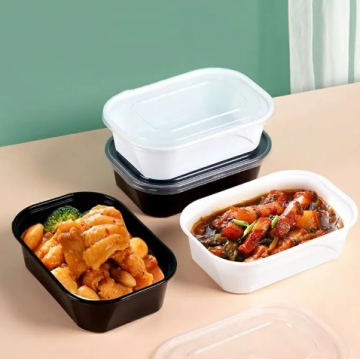 Wegwerpmicrowavable Bento -lunchbox - 35 oz, zwart, elliptische vorm, lekvrij, één compartiment, plastic afnemen