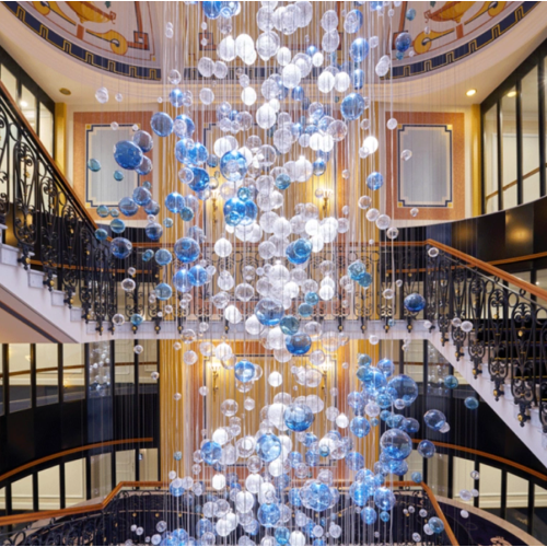 Large glass chandelier in hotel lobby