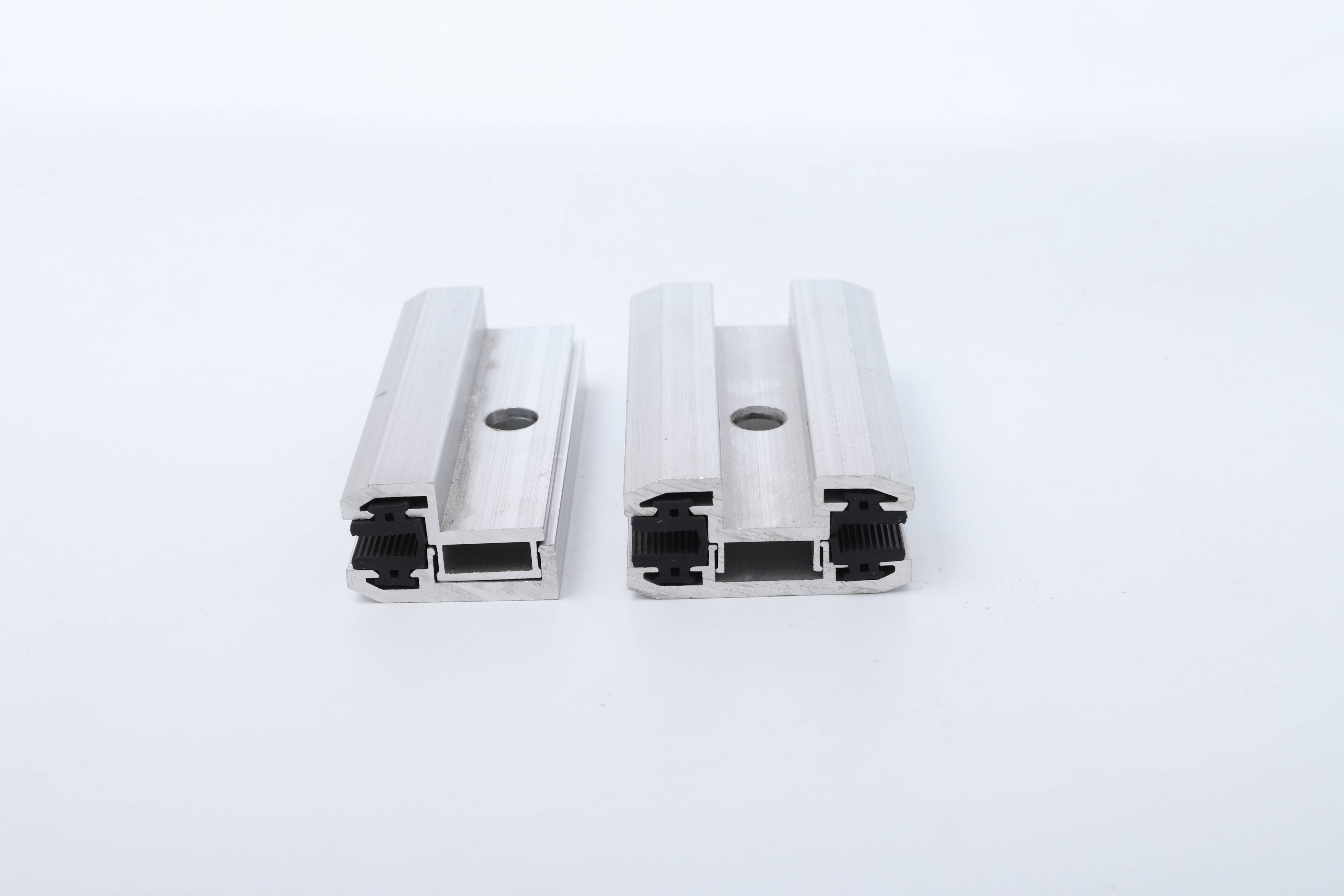 Aluminum end clamps for glass panels