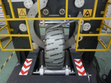 Motorcycle tire wrapping stretch film machine