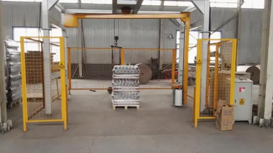 Rotary-arm conveyor pallet wrapper