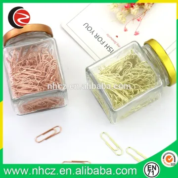 1.25 inch gold and rose gold paper clip in glass jar