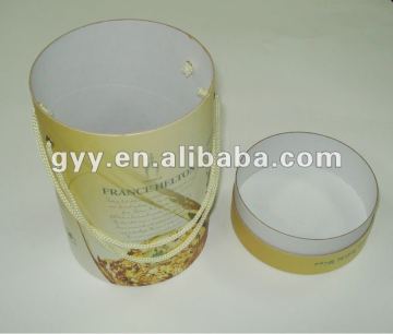 Round golden paper box with PP rope handle/eyelet
