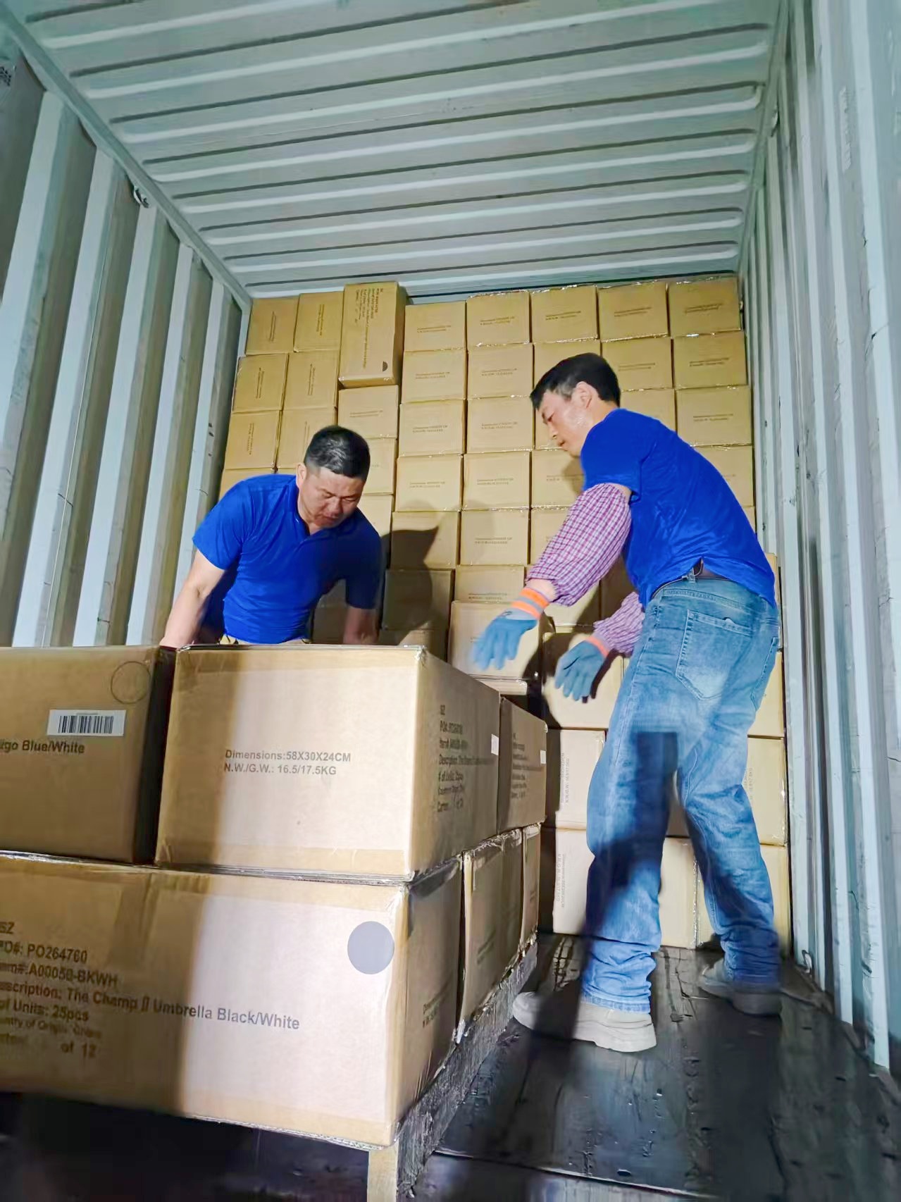 Loading umbrellas into shipping container