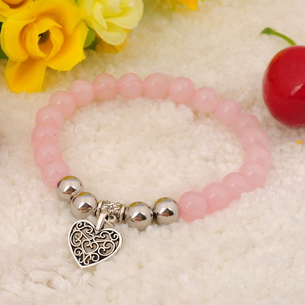 Pulsera de cuarzo rosa natural. Colgantes de aleación de piedras preciosas.